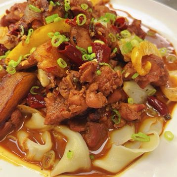 A22.Braised Chicken with Potatoes, Bell Peppers and Handmade Noodles in a Rich, Savory Sauce🌶