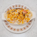 Baked seafood with cream sauce on rice
